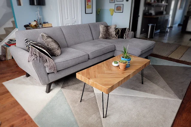 living room view with Joybird Hyland sectional and new coffee table
