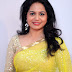 Tollywood Singer Sunitha Stills In Transparent Yellow Saree and Golden Matching Blouse