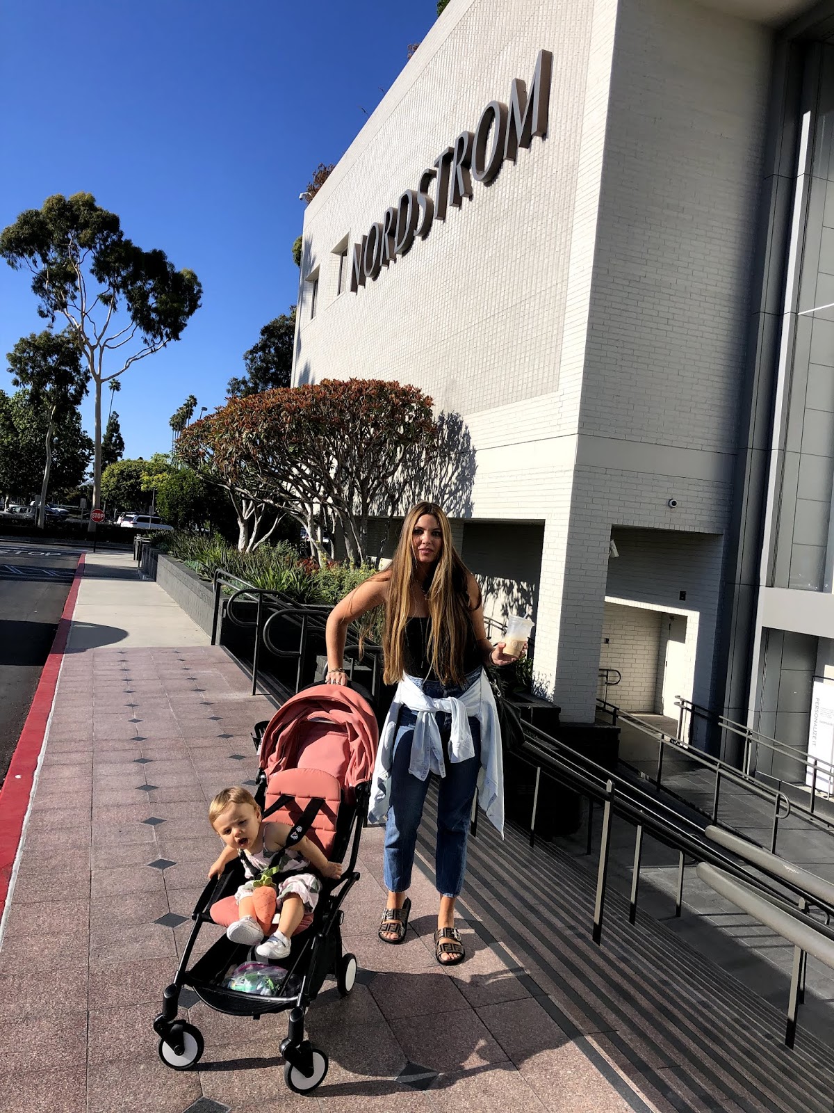 woman with her kid on stroller