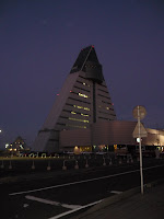 Triangle shaped Apasm Center building from across the road