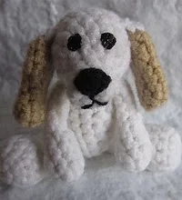 http://www.ravelry.com/patterns/library/prince-the-tiny-puppy