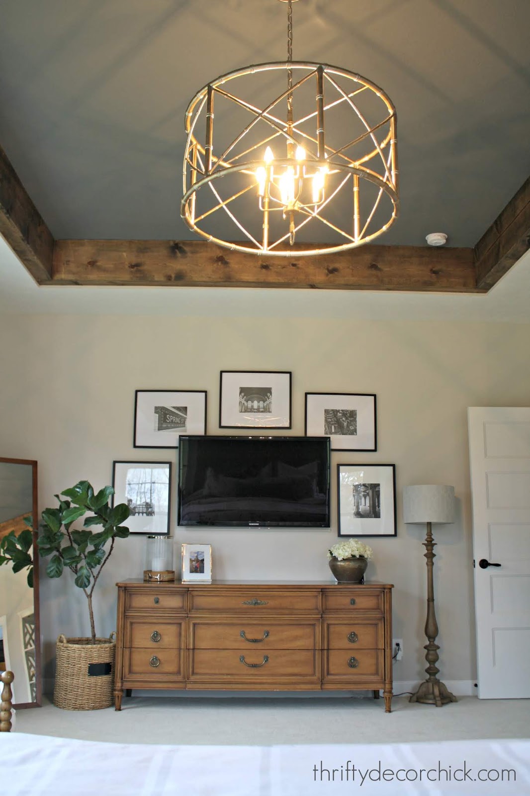 Dark gray tray ceiling and wooden beams