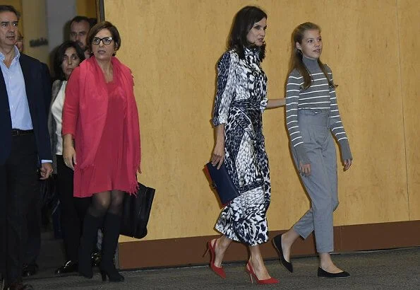 Queen Letizia wore a leopard-print silk blouse and midi skirt by Victoria Beckham. Crown Princess Leonor, Carolina Herrera