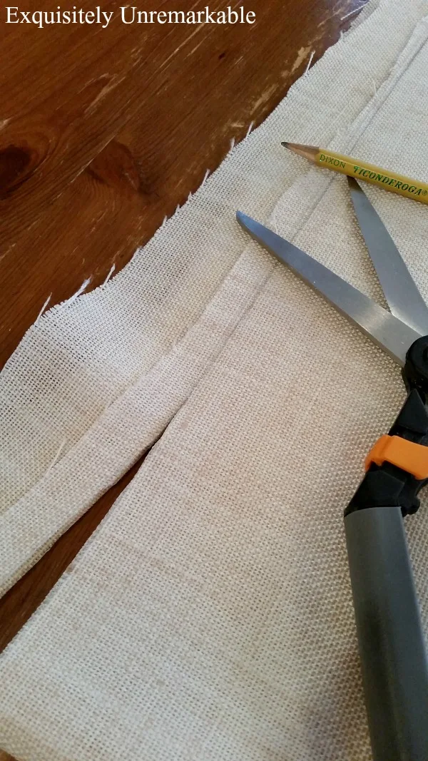 Cutting linen fabric with fabric scissors