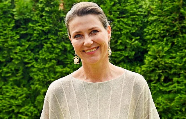 Norway Muscular Dystrophy Association. Princess Martha Louise wore a beige natural sweater and gold floral earrings