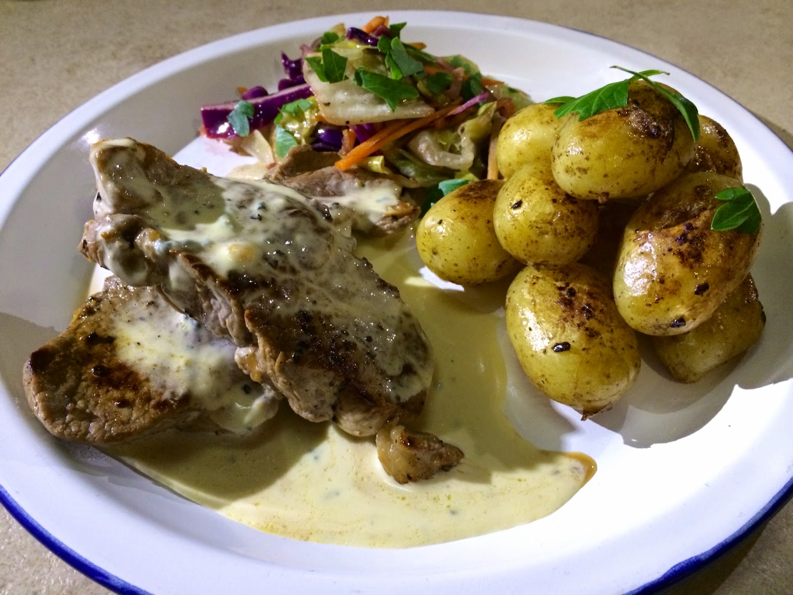 In My Caravan Kitchen Lamb Steaks in Blue Cheese Sauce, Sautéed New Spuds, Salad and Garlic