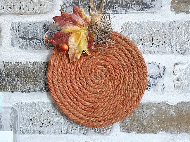 jute pumpkin on brick background