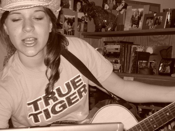 Mizzou True Tiger playing guitar