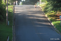 Gary Droze (1st, 17:57) negotiates one of Florida's nonexistent hills near the end of his winning run at Quincy's second annual Run With The Moose 5K on 23 July 2011 Hill