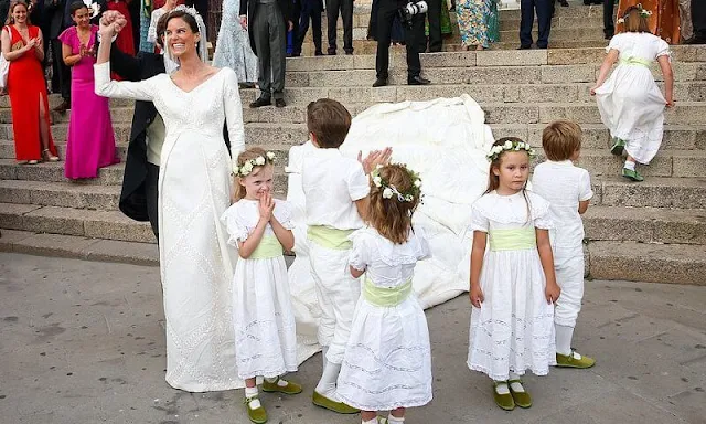 Princess Marie Astrid wore the Kinsky Honeysuckle tiara from the collection of the Princely Family of Liechtenstein. Wedding dress