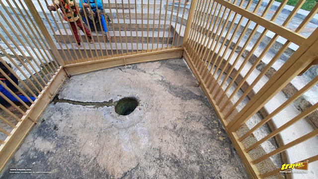 The spring called Namada Chilume, surrounded by a cage-like protective structure