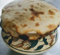 Dum pukht veg biryani  using wheat flour dough on a biryani pot