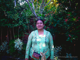 Woman With Green Traditional Balinese Dress In The Garden Of The Balinese Temple At Ringdikit Village North Bali Indonesia