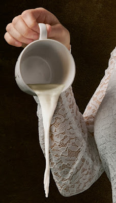 Woman spilling milk.