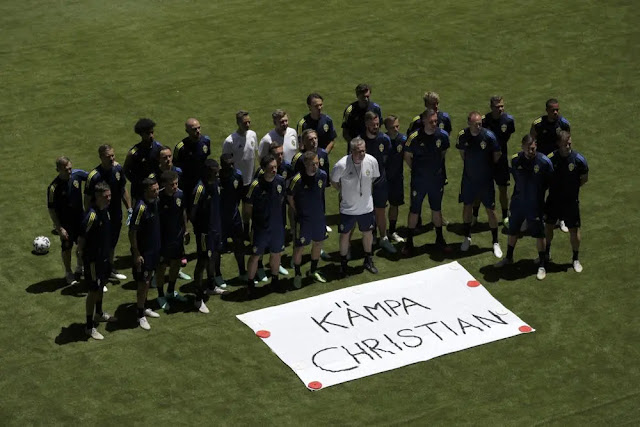 The Swedish team poses for a photo with a sign that reads "Get Well Christian" during a training session at La Cartuja stadium in Seville, Spain, June 13, 2021. Photo: AP