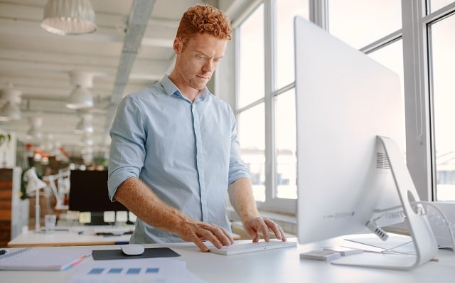 standing desks improve health employee workplace wellness ergonomic office furniture