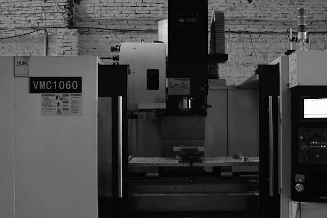 What are the advantages and disadvantages of CNC machining centers?