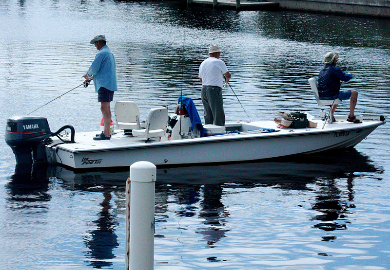 Punta Gorda Florida Daily Photo Off the Dock Men Fish in a Canal