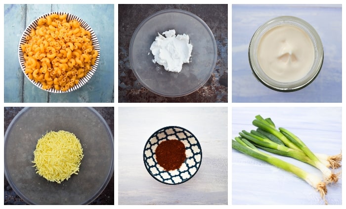 Ingredients to make creamy cheese pasta salad - macaroni, vegan cheddar, vegan cream cheese, vegan mayo, paprika & spring onions