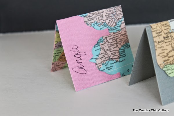 http://www.thecountrychiccottage.net/2014/02/recycled-map-placecards.html