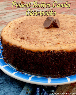 Peanut Butter Candy Cheesecake, a creamy Reese’s cheesecake, studded with chopped Butterfingers and topped with a shaved chocolate bar. | recipe developed by www.BakingInATornado.com | #recipe #dessert