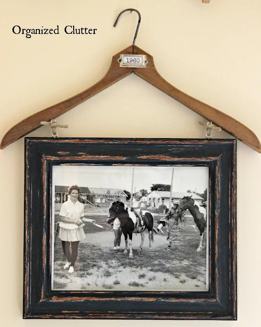 Photo of a wooden hanger/frame display.