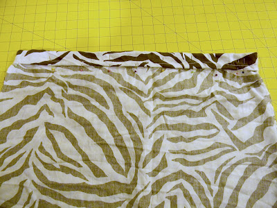 Sew along the bottom of this fold, leaving a small opening unsewn (the ...