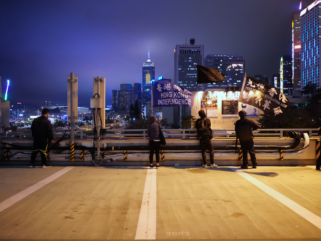 Independence and Revolution Waving Above a Public Square in Hong Kong