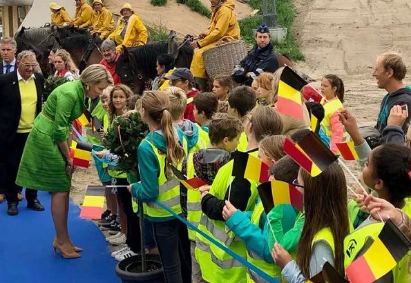 Queen Mathilde of Belgium visited a camp in Ter Helme. Queen Mathilde wore Natan combination during two visits in Oostduinkerke