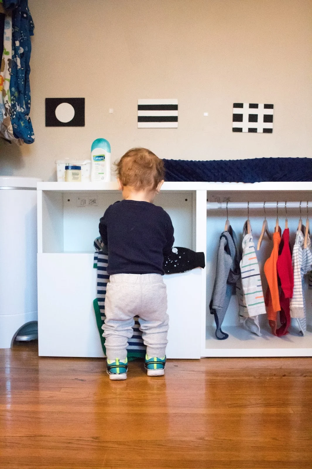 A DIY Montessori toddler wardrobe made with IKEA BESTA shelving 