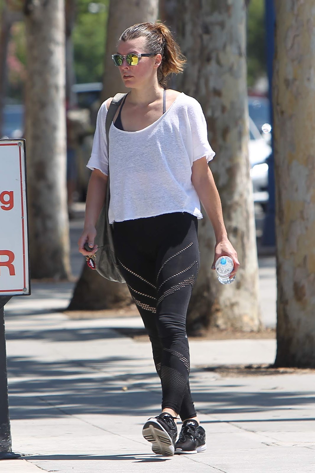 Milla Jovovich exits the gym after a morning workout in West Hollywood