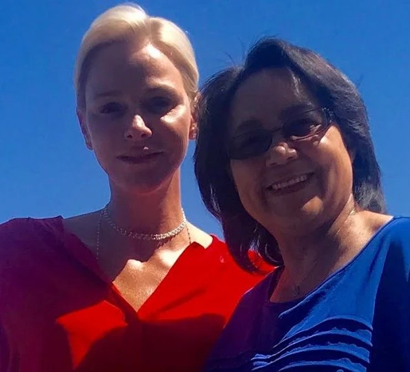 Princess Charlene met with Cape Town Mayor Patricia de Lille. Princess Charlene of Monaco Foundation. Princess Charlene wore red blouse