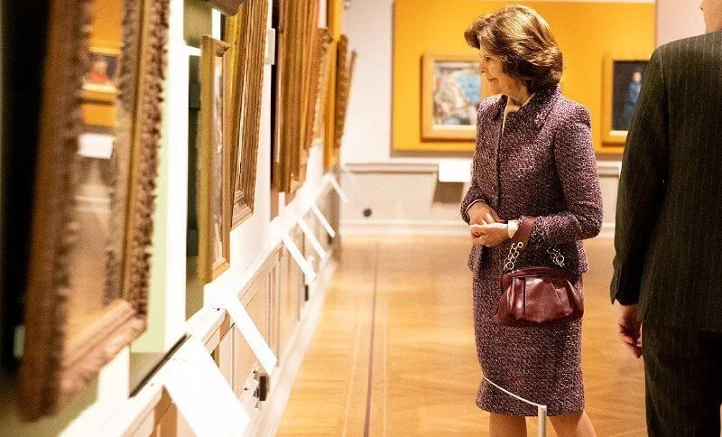 Queen Silvia wore a red-ecru maroon tweed jacket and skirt from Chanel cruise collection