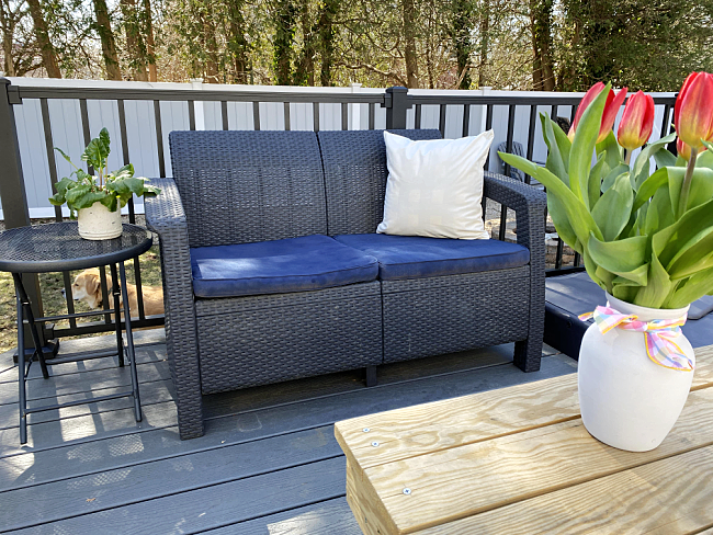 Outdoor love seat with painted cushions