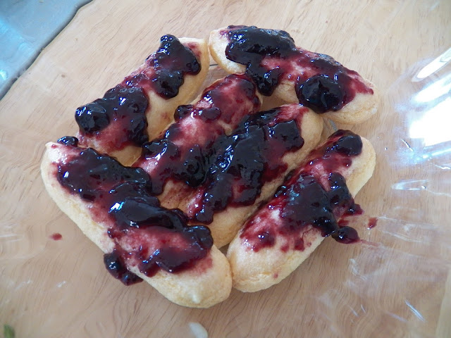 Ladyfingers and jam in bottom of bowl