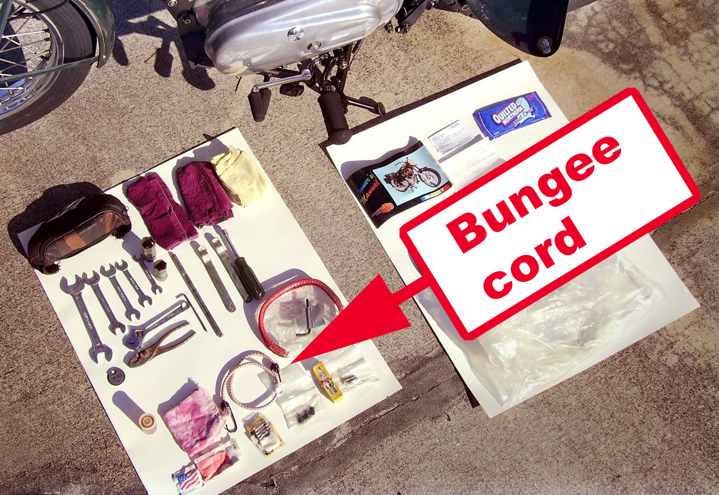 Yes, my Royal Enfield tool kit includes a bungee