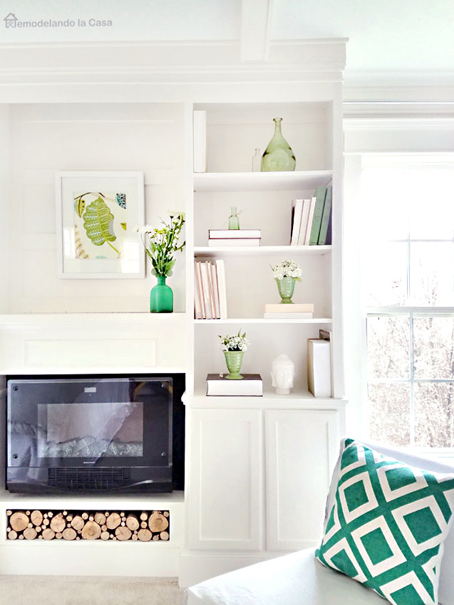 Green pops of color in the bedroom bookcase