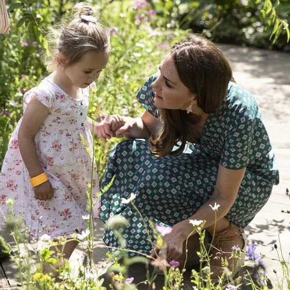 Kate Middleton wore a short sleeved printed dress by Sandro, Castaner Carina wedge, Accessorize polly petal drop earrings