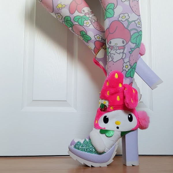 wearing My Melody Sanrio ankle boots with matching printed tights