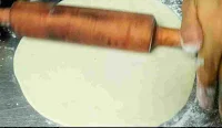 Rolling rumali roti with a.roller pin