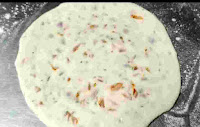 Flatten round shaped onion kulcha dough