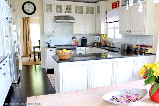white kitchen cabinets marble backsplash