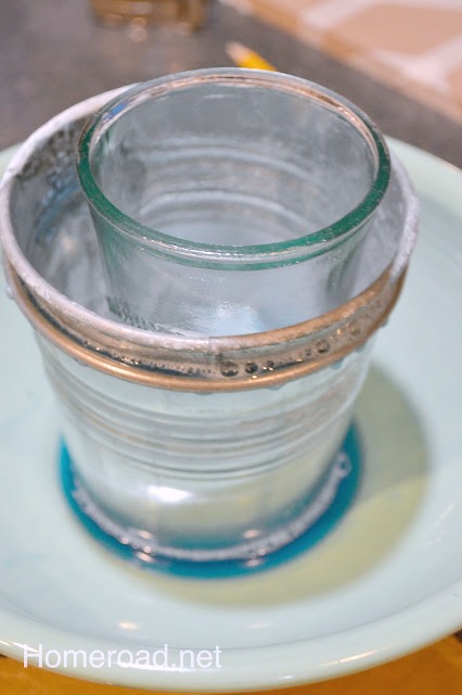 Glass jar inside a metal bucket