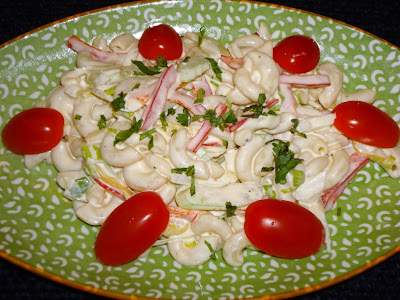 MACARONI SALAD PORTIONS: 3 INGREDIENTS 2 cups cooked elbow macaroni 1/3 cup Julianne red peppers 1/3 cup julienne yellow peppers 1/3 cup sliced scallions ½ cup Julianne onions 1 tbsp. chopped parsley 2/3 cup mayonnaise 2 tbsp. sour cream 1 tbsp. Dijon mustard 2 tbsp. red wine vinegar Salt and pepper to taste Grape tomatoes (optional) METHOD Cook, measure and cut ingredients necessary for the recipe. In a bowl mix mayonnaise with sour cream, mustard and red wine vinegar. Add pasta, red peppers, yellow peppers, scallions, onions and parsley. Mix and season it with salt and pepper to taste.