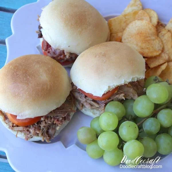 10 Quick Dinner Ideas for Back-to-School, featuring pulled pork sandwiches with sliced tomatoes, chips and green grapes.