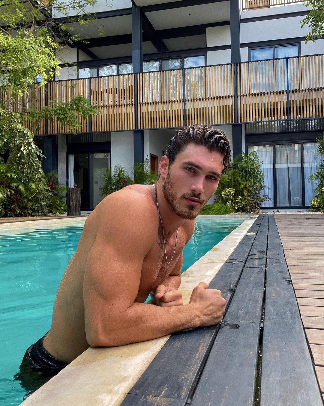 romantic-bearded-hot-guy-pool-swimming