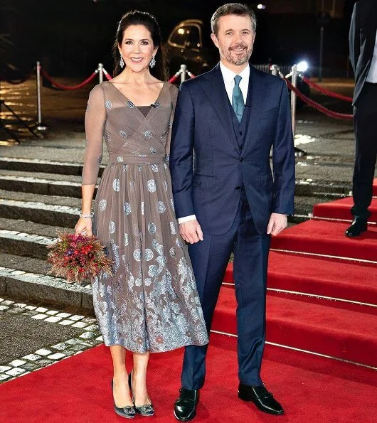Crown Princess Mary wore a new bespoke silk chiffon and metallic embroidery dress from Soeren Le Schmidt, and aquamarine girandole earrings