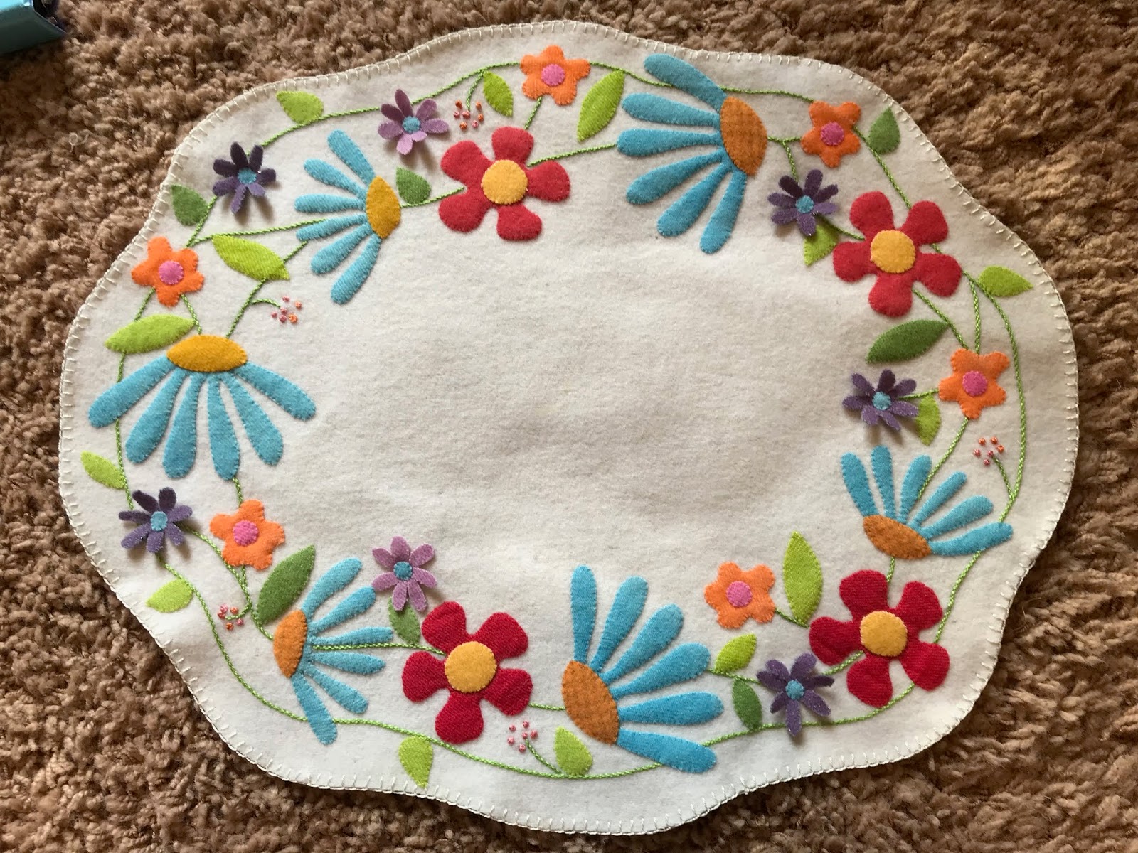 Sherrie loves color! "Summertime" wool table mat is done!