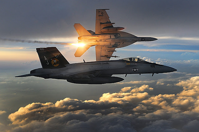 U.S. Navy F/A-18 Super Hornets deploy heat flares