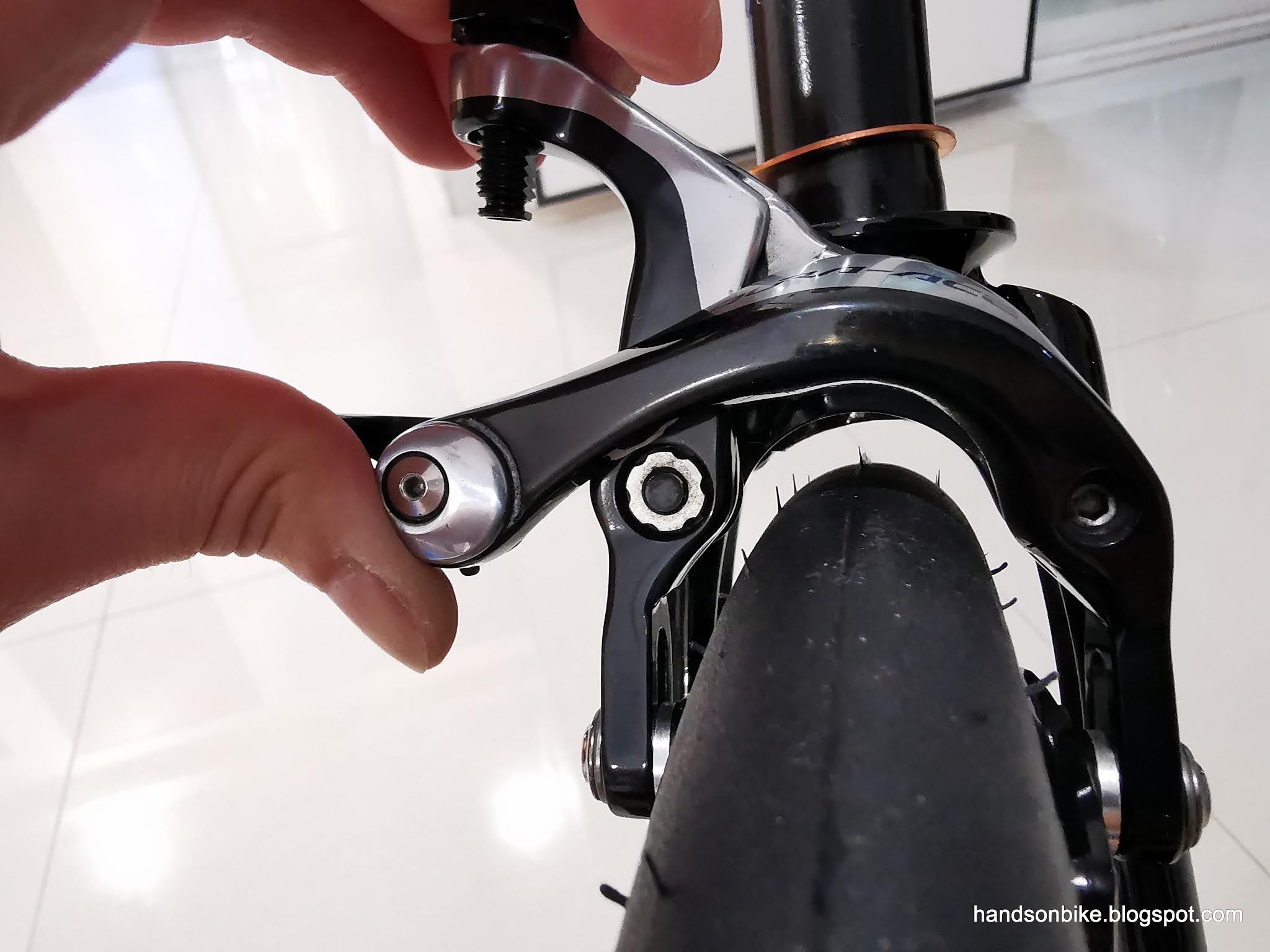 how to tighten caliper bike brakes